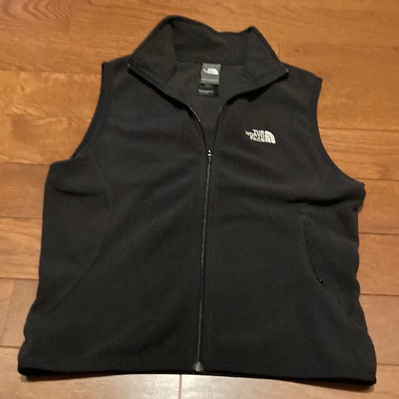 Black north face vests. Lightly worn